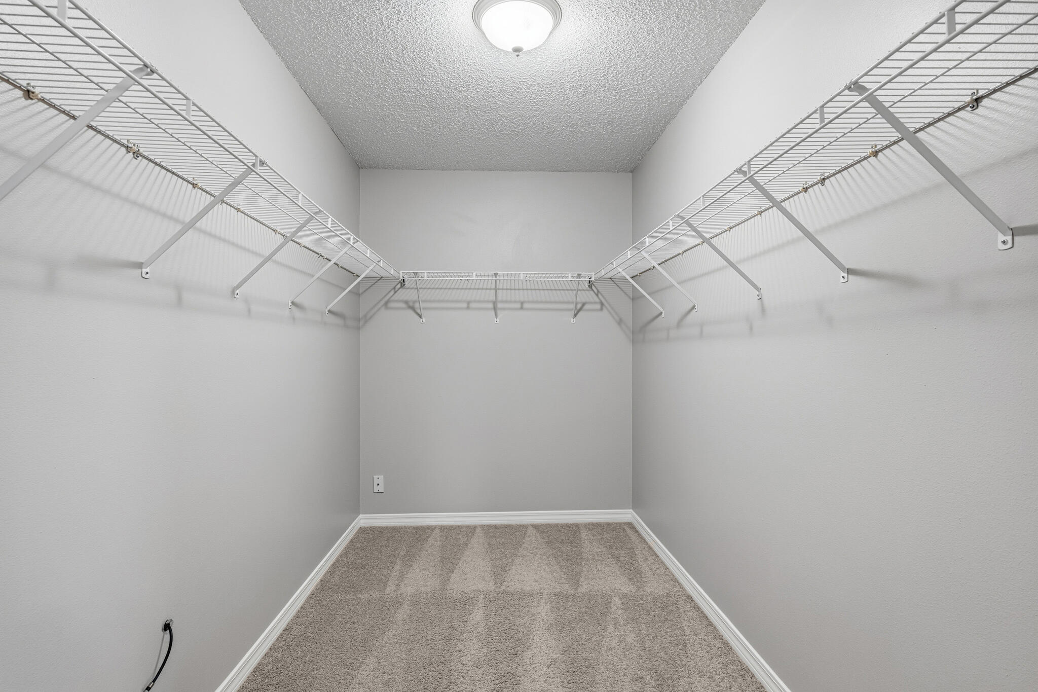 643 Alysheba Drive Crestview, FL 32539 - Photo 21 of 36 a view of a room with racks on the wall