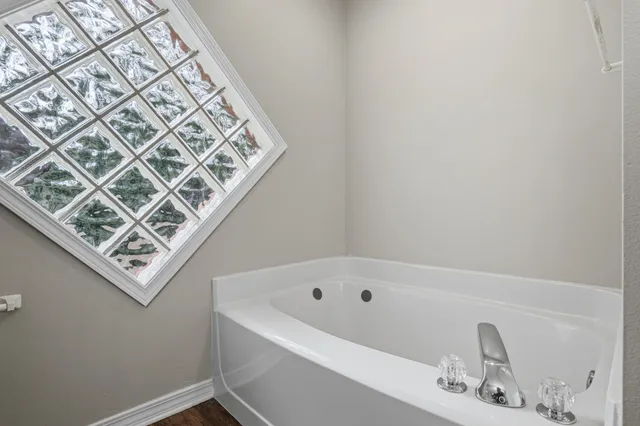 a view of an empty room with a cabinet