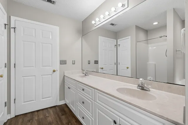 a view of a table and chairs in back of the house