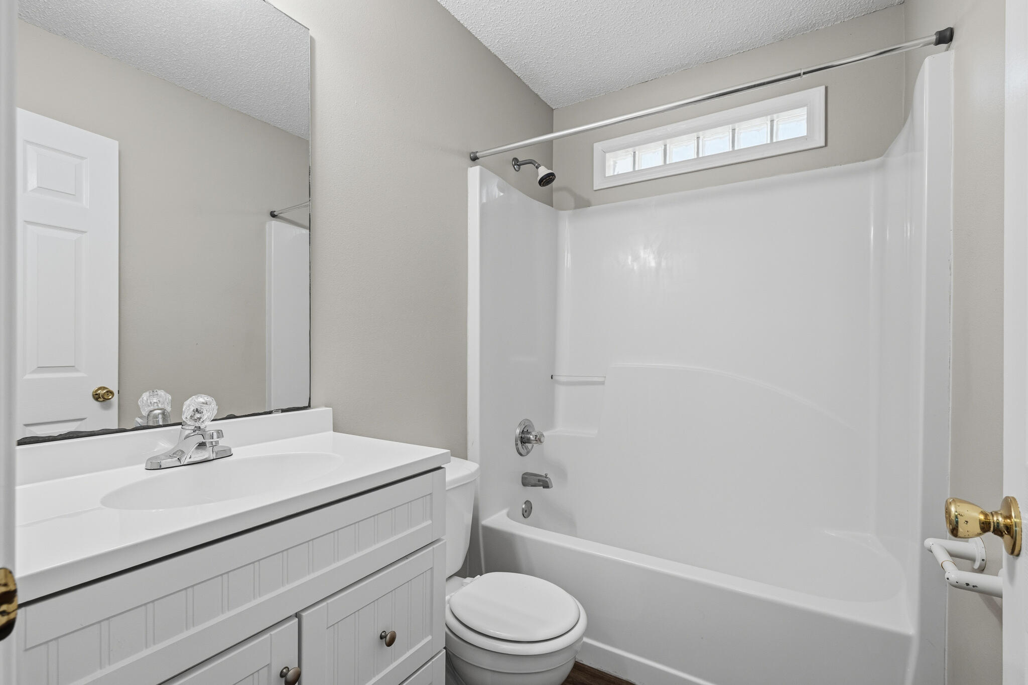 643 Alysheba Drive Crestview, FL 32539 - Photo 29 of 36 a bathroom with a sink a mirror a toilet and shower