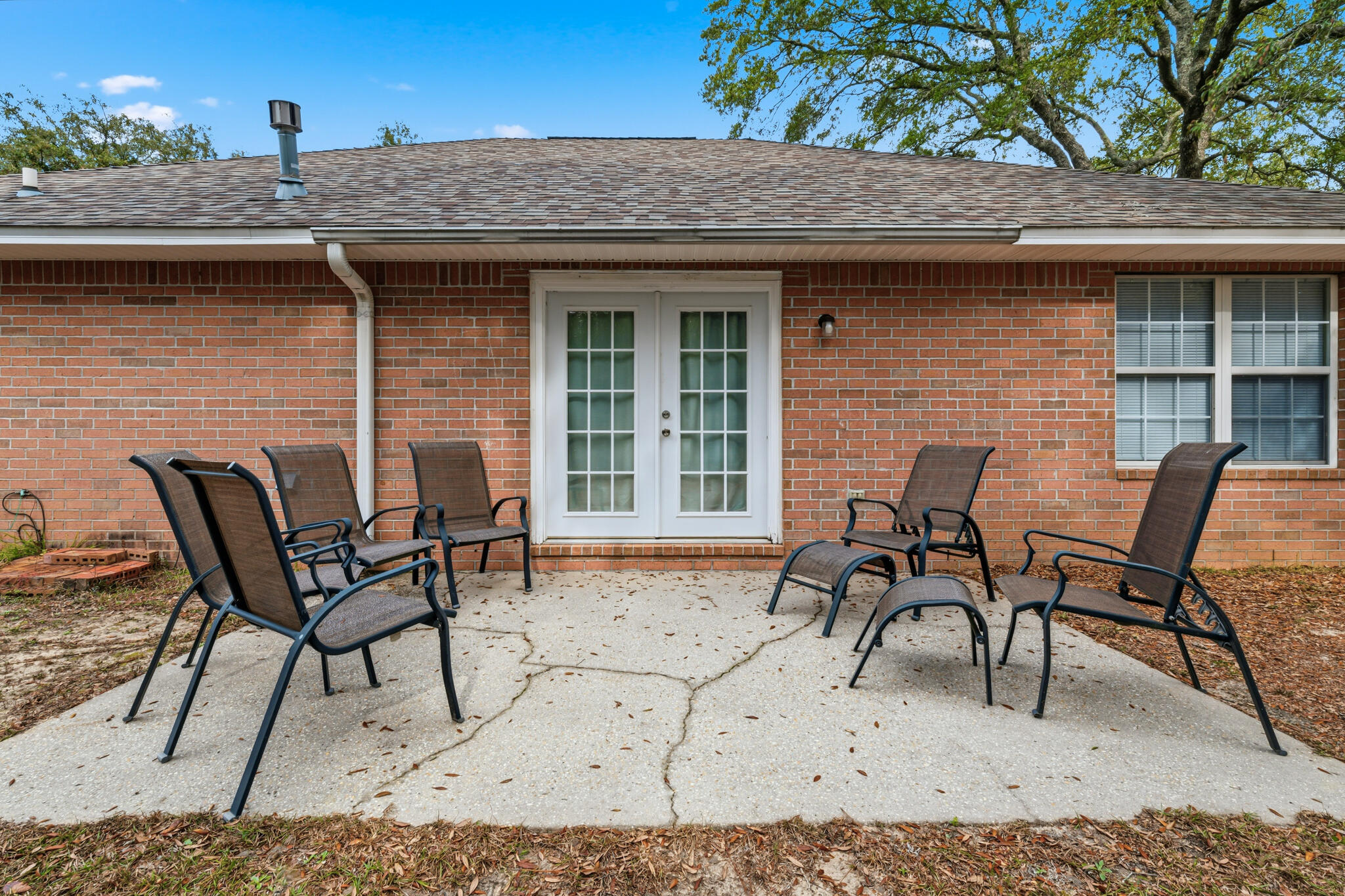 643 Alysheba Drive Crestview, FL 32539 - Photo 32 of 36 a view of a table and chairs in back of the house