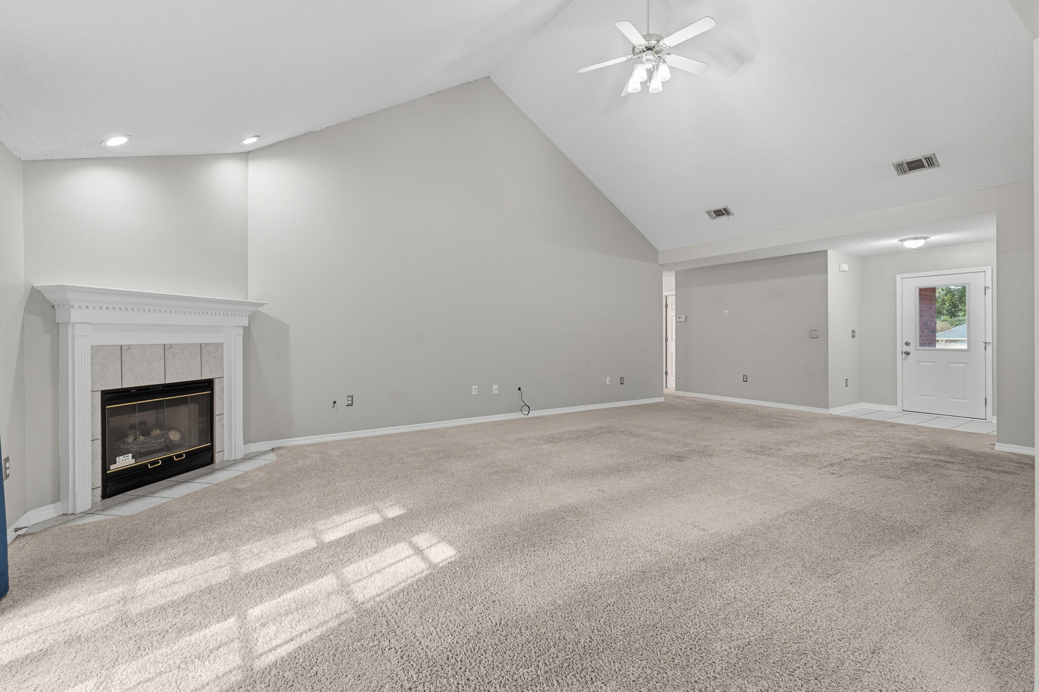643 Alysheba Drive Crestview, FL 32539 - Photo 6 of 36 a view of empty room with fan and fireplace