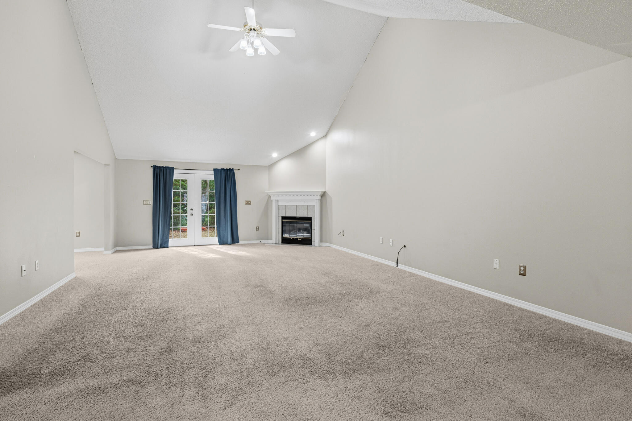 643 Alysheba Drive Crestview, FL 32539 - Photo 7 of 36 a view of an empty room with a fireplace