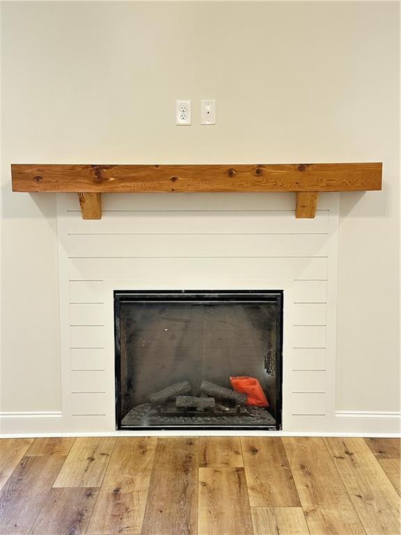 10 Lee Road Salem, AL 36874 - Photo 7 of 25 Fireplace featuring a natural wood mantel and shiplap-style surround