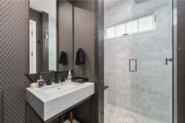 a bathroom with a sink and a mirror