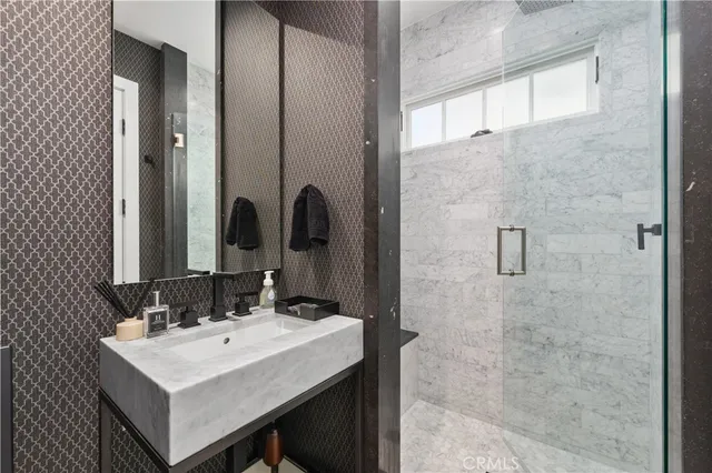 a bathroom with a sink and a mirror