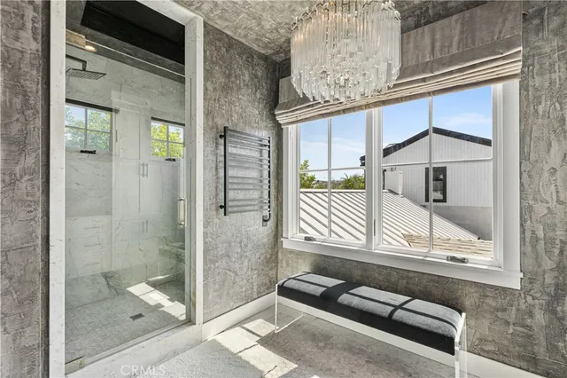 a bathroom with a bathtub and shower