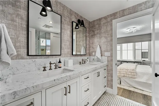 a bathroom with a double vanity sink and mirror