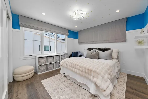 a living room with furniture and a mirror