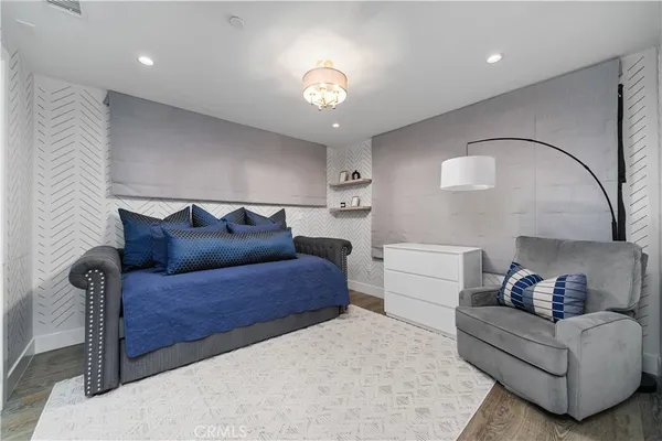 a bathroom with a sink toilet vanity and shower