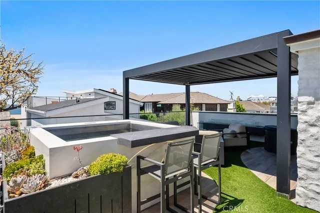 a view of roof deck with furniture