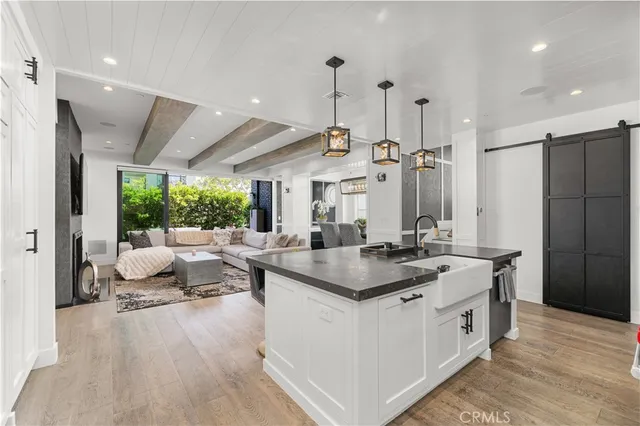 a kitchen with stainless steel appliances granite countertop a lot of counter space and a refrigerator
