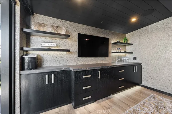 a outdoor living room with furniture and a potted plant