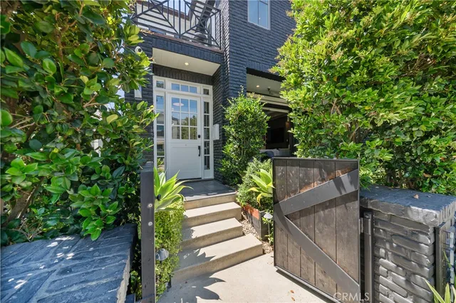 a balcony with furniture and a potted plant