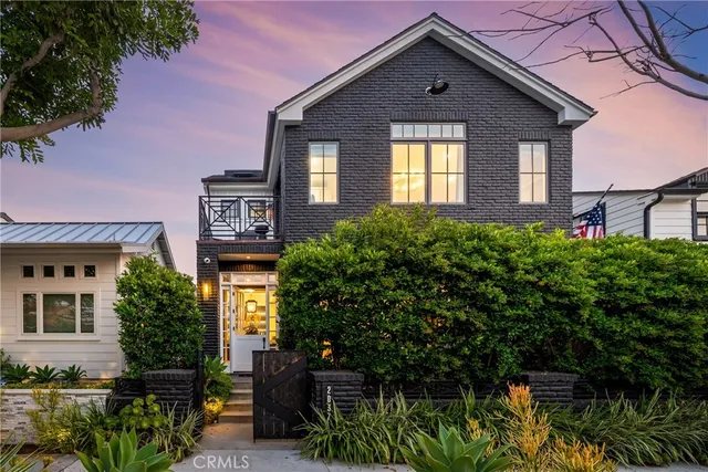 a balcony with seating space and swimming pool in the back