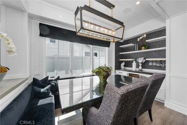 a dining room with furniture and a window