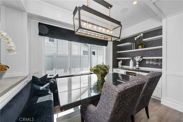 a dining room with furniture and a window