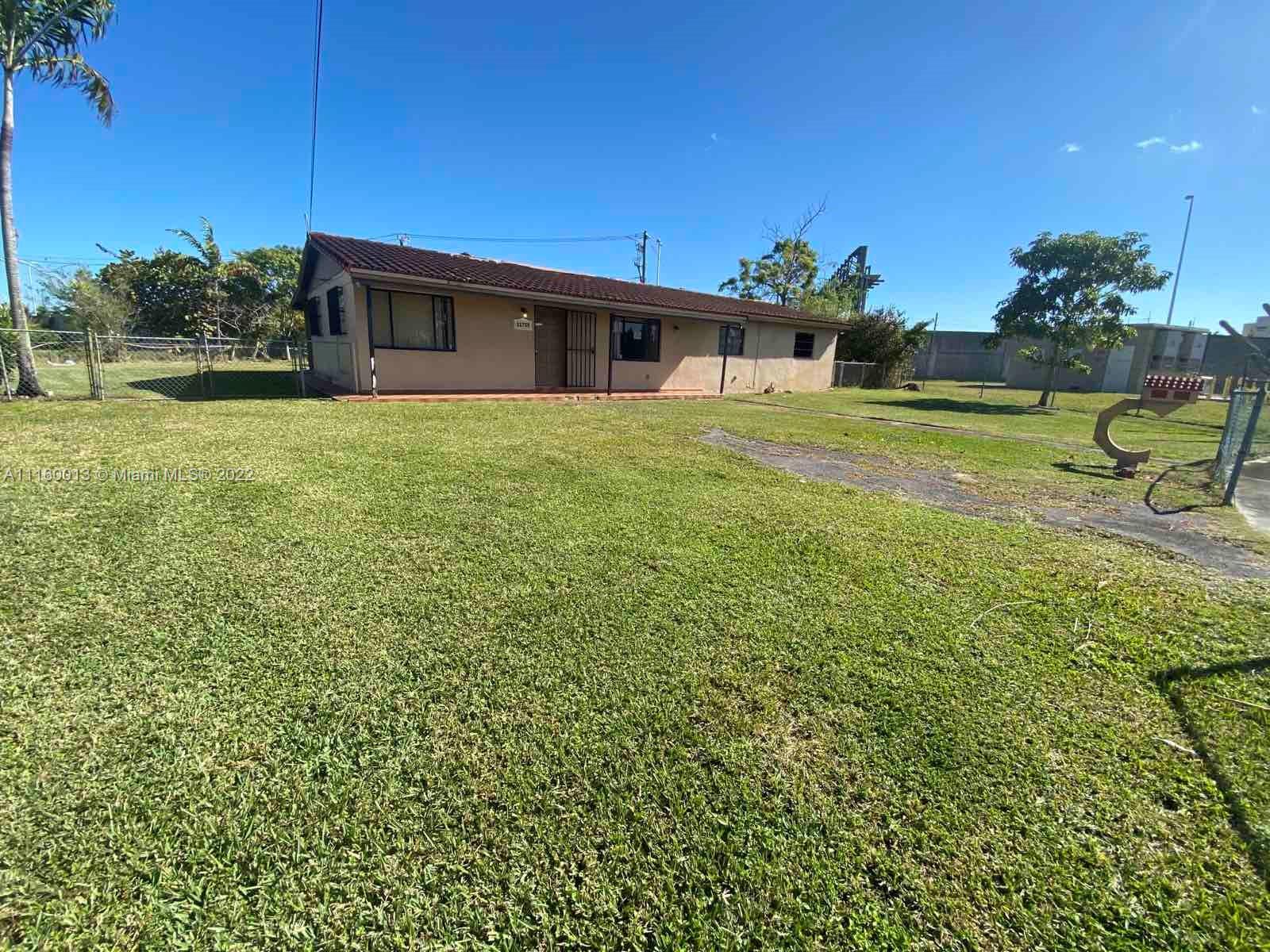 11755 Southwest 37th Street Miami, FL 33175 - Photo 2 of 11 a view of a house with a yard