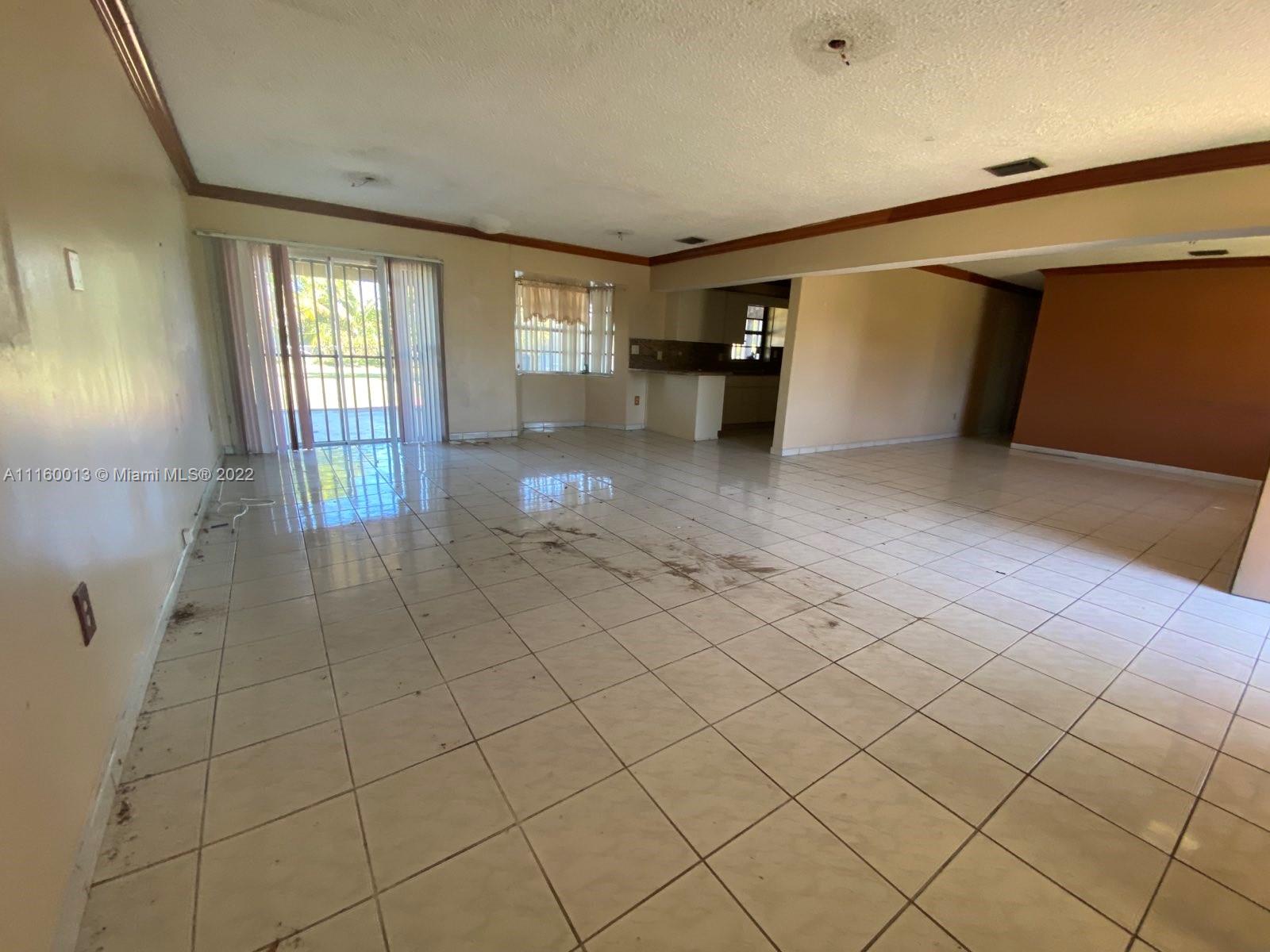 11755 Southwest 37th Street Miami, FL 33175 - Photo 7 of 11 a view of an empty room and window