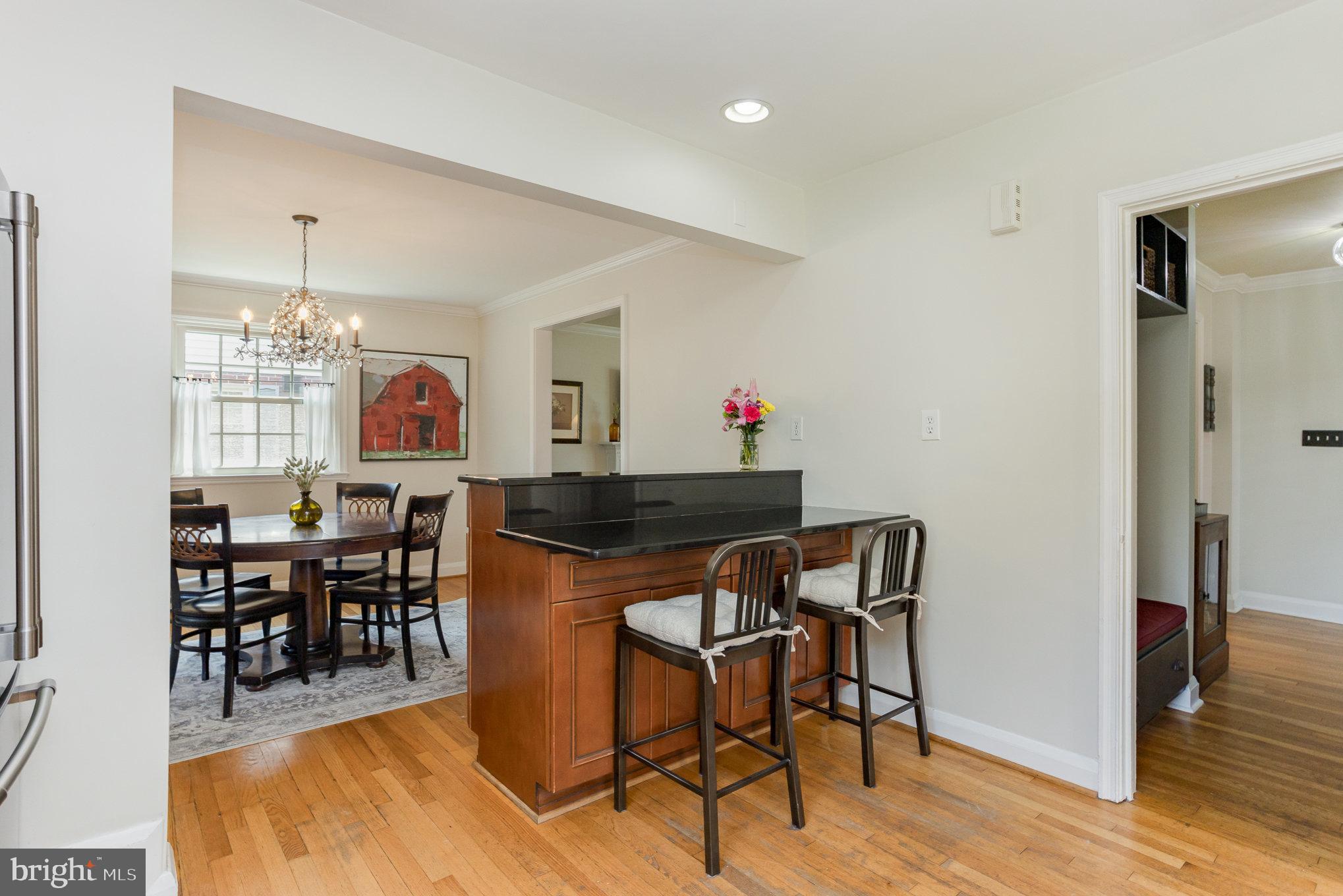 4407 Sedgwick Road Baltimore, MD 21210 - Photo 11 of 42 a view of a dining room with furniture and wooden floor