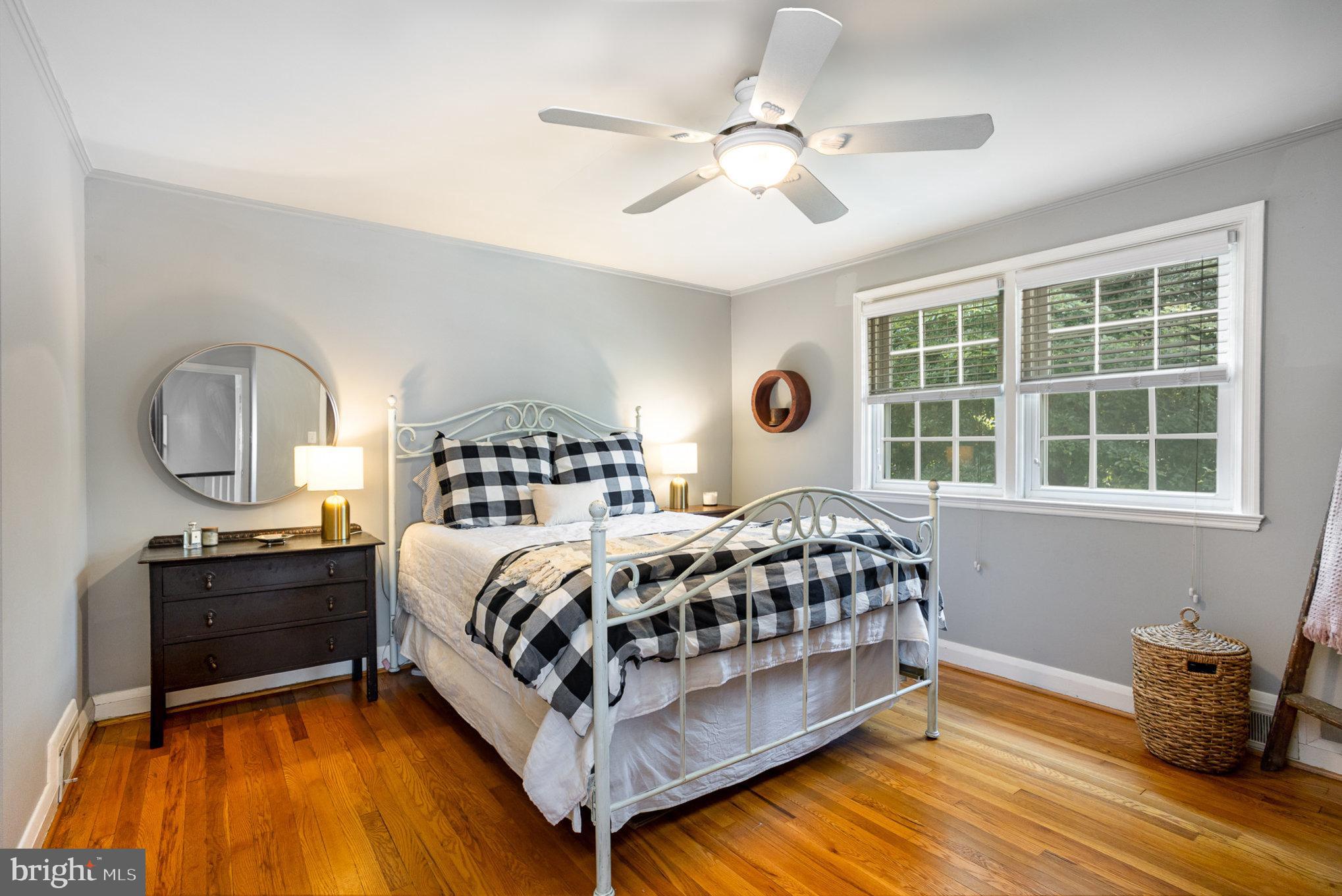 4407 Sedgwick Road Baltimore, MD 21210 - Photo 21 of 42 a bedroom with a bed wooden floor and window