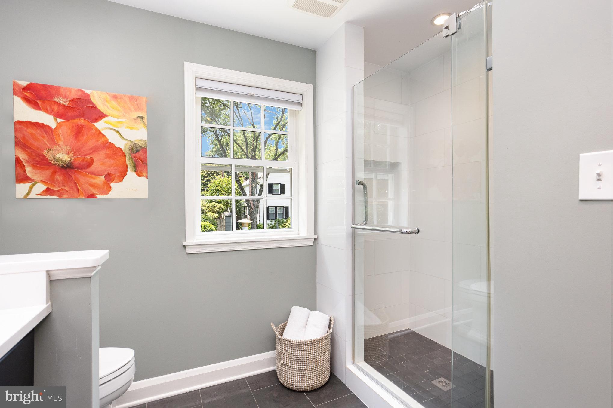 4407 Sedgwick Road Baltimore, MD 21210 - Photo 27 of 42 a bathroom with a toilet and a window