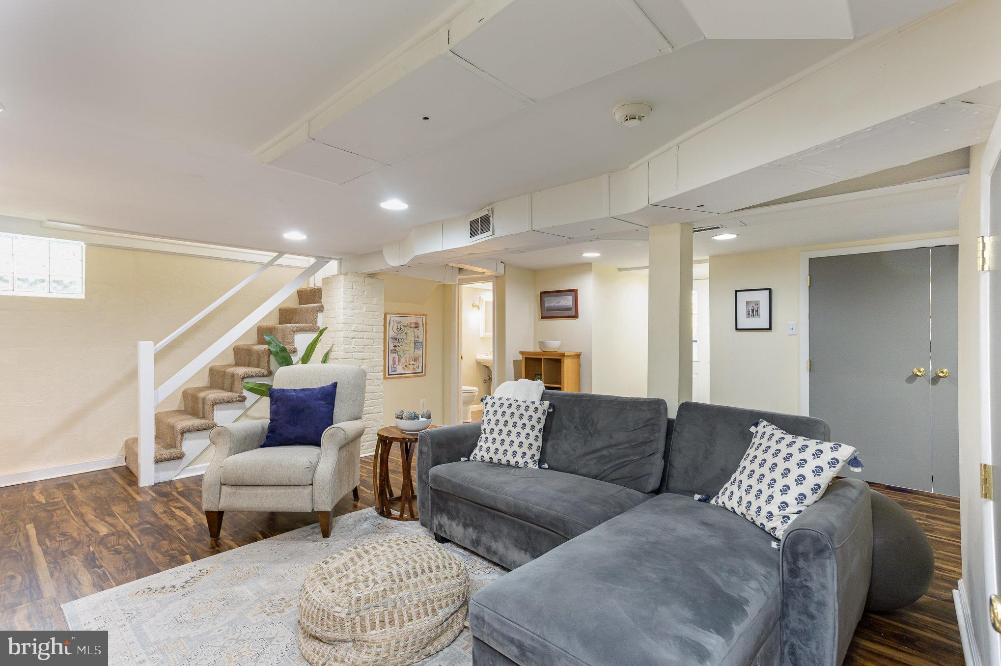 4407 Sedgwick Road Baltimore, MD 21210 - Photo 28 of 42 a living room with furniture and a wooden floor