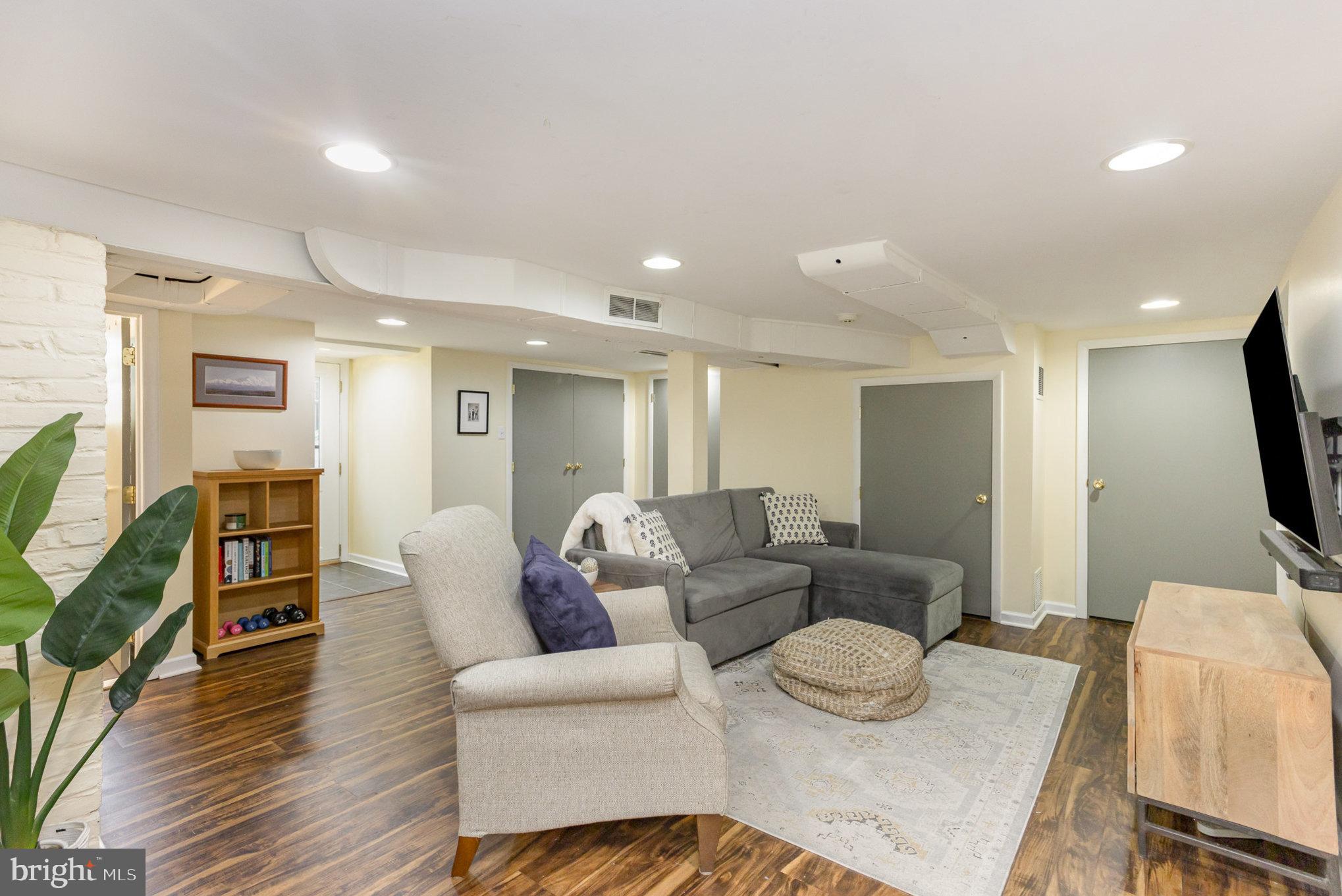 4407 Sedgwick Road Baltimore, MD 21210 - Photo 29 of 42 a living room with furniture and a flat screen tv