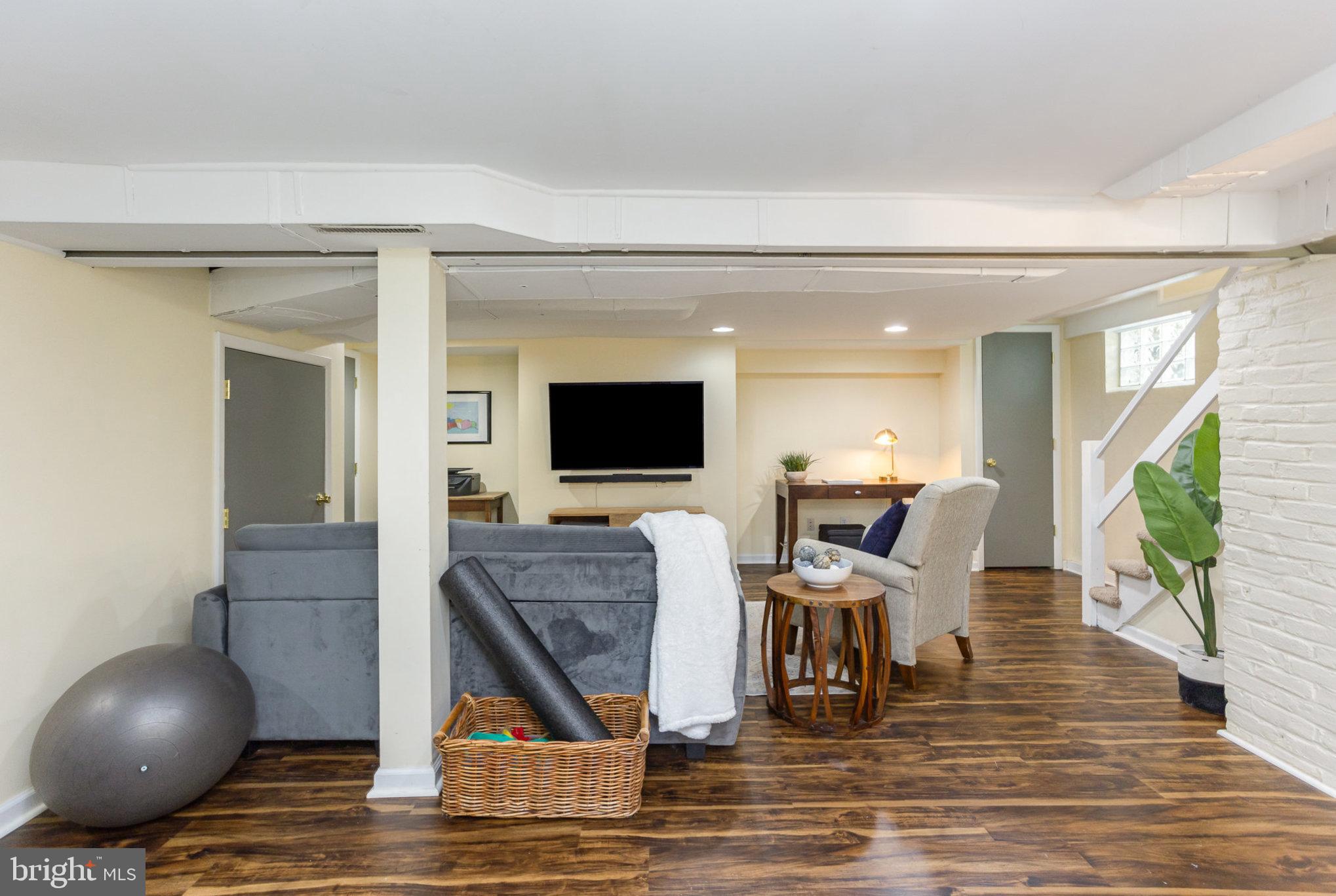 4407 Sedgwick Road Baltimore, MD 21210 - Photo 30 of 42 a living room with furniture and a flat screen tv