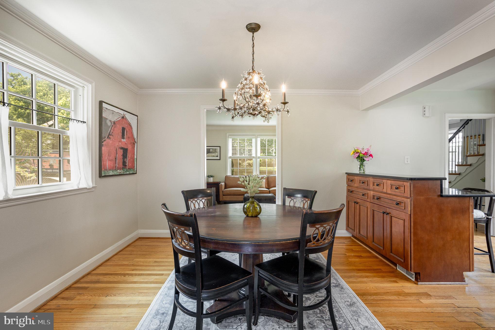 4407 Sedgwick Road Baltimore, MD 21210 - Photo 10 of 42 a view of a dining room with furniture window and wooden floor