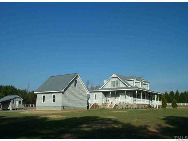 5490 Raleigh Road Benson, NC 27504 - Photo 1 of 1 a front view of a house with a yard