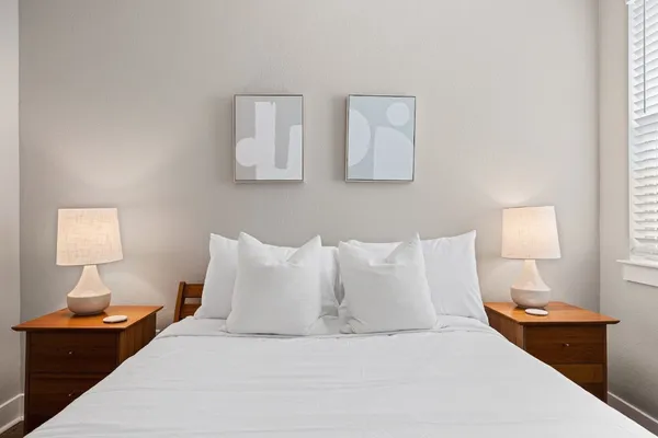 a bed room with furniture and a window