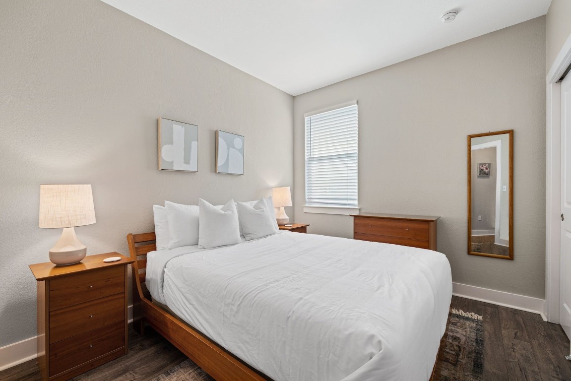 2215 Katy Lane, Unit C Georgetown, TX 78626 - Photo 20 of 26 a bedroom with a bed and a lamp