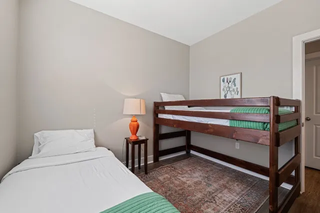 a bed room with furniture and a window