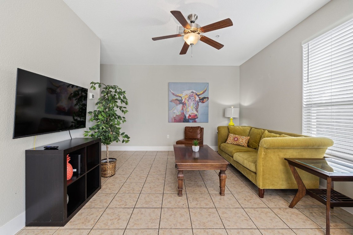 2215 Katy Lane, Unit C Georgetown, TX 78626 - Photo 4 of 26 a living room with furniture and a flat screen tv