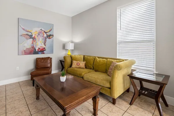 a living room with furniture and a window