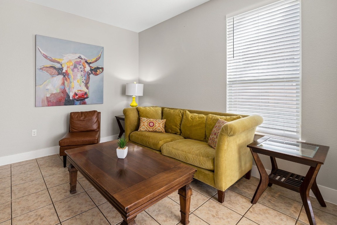 2215 Katy Lane, Unit C Georgetown, TX 78626 - Photo 5 of 26 a living room with furniture and a window