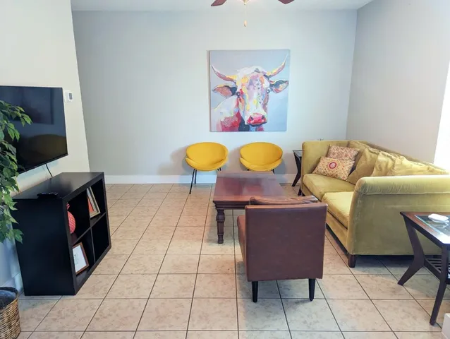 a living room with furniture and a table