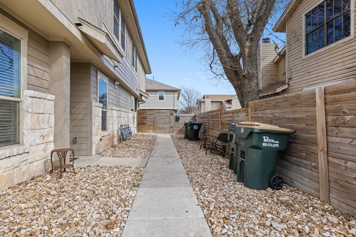 2215 Katy Lane, Unit C Georgetown, TX 78626 - Photo 8 of 26 a view of a porch with wooden fence and a bench