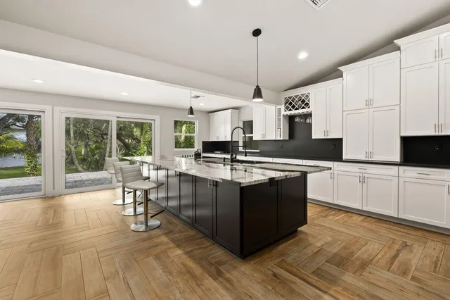 a view of a yard with plants and trees