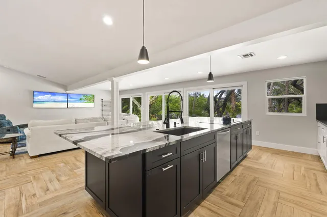 a front view of house with yard and trees