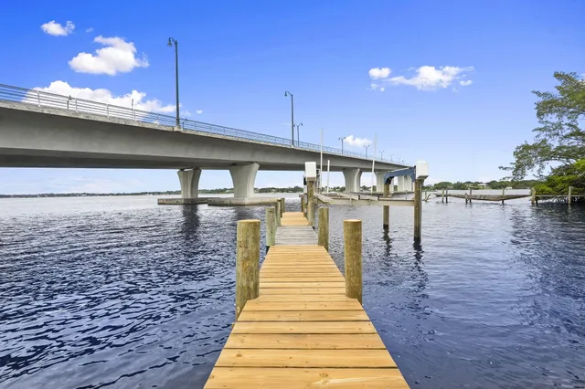 a kitchen with stainless steel appliances granite countertop a sink and a wooden floors