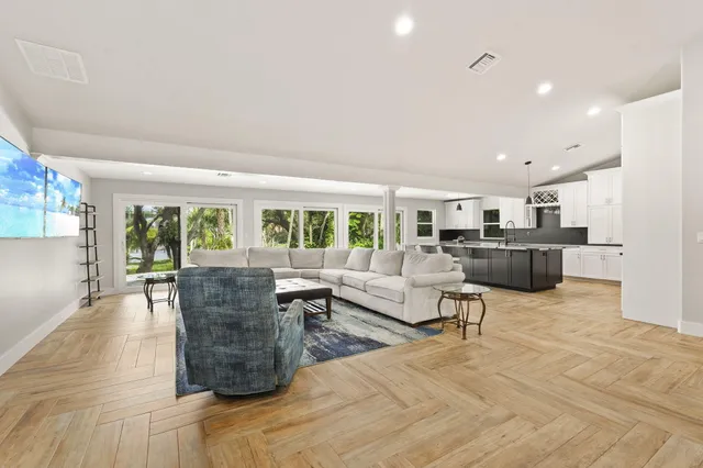 a bedroom with a bed and a ceiling fan