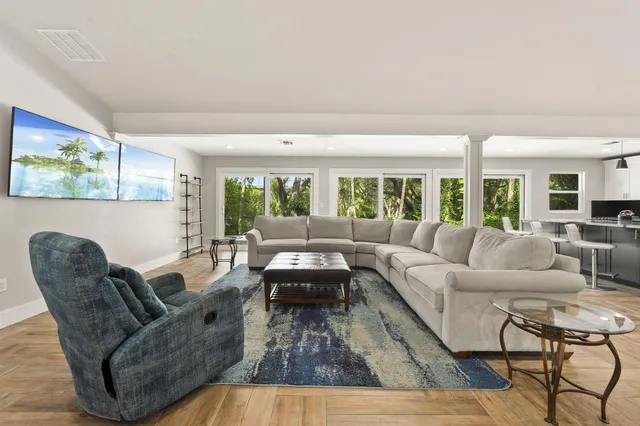 a bathroom with a glass shower door and a bathtub