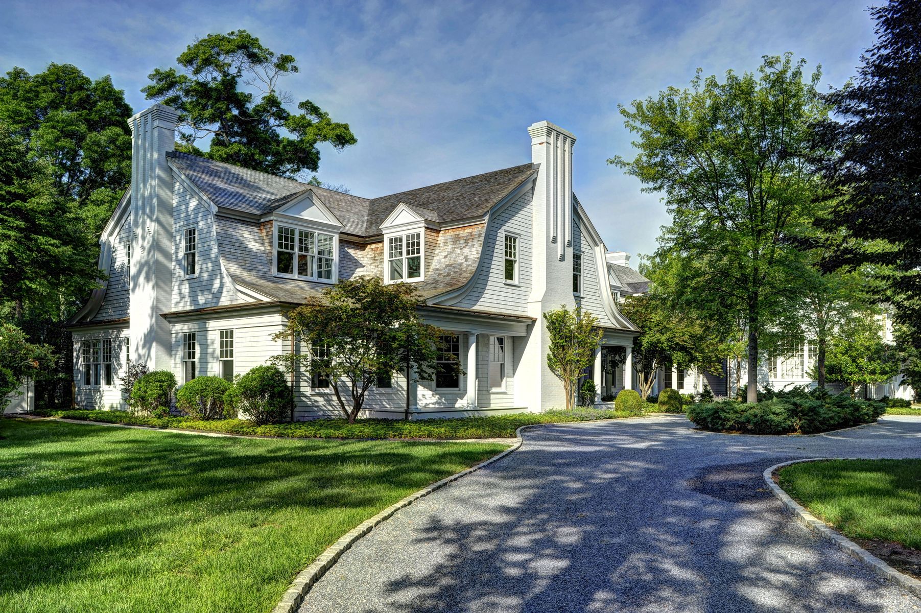 11 Jones Cove Road East Hampton, NY 11937 - Photo 1 of 25 a front view of a house with a yard