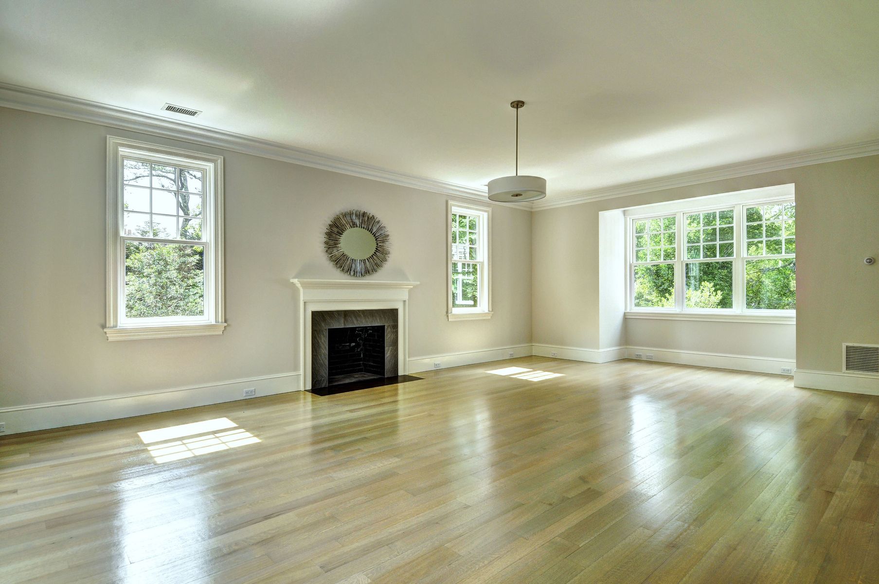 11 Jones Cove Road East Hampton, NY 11937 - Photo 15 of 25 a view of an empty room with wooden floor fireplace and a window