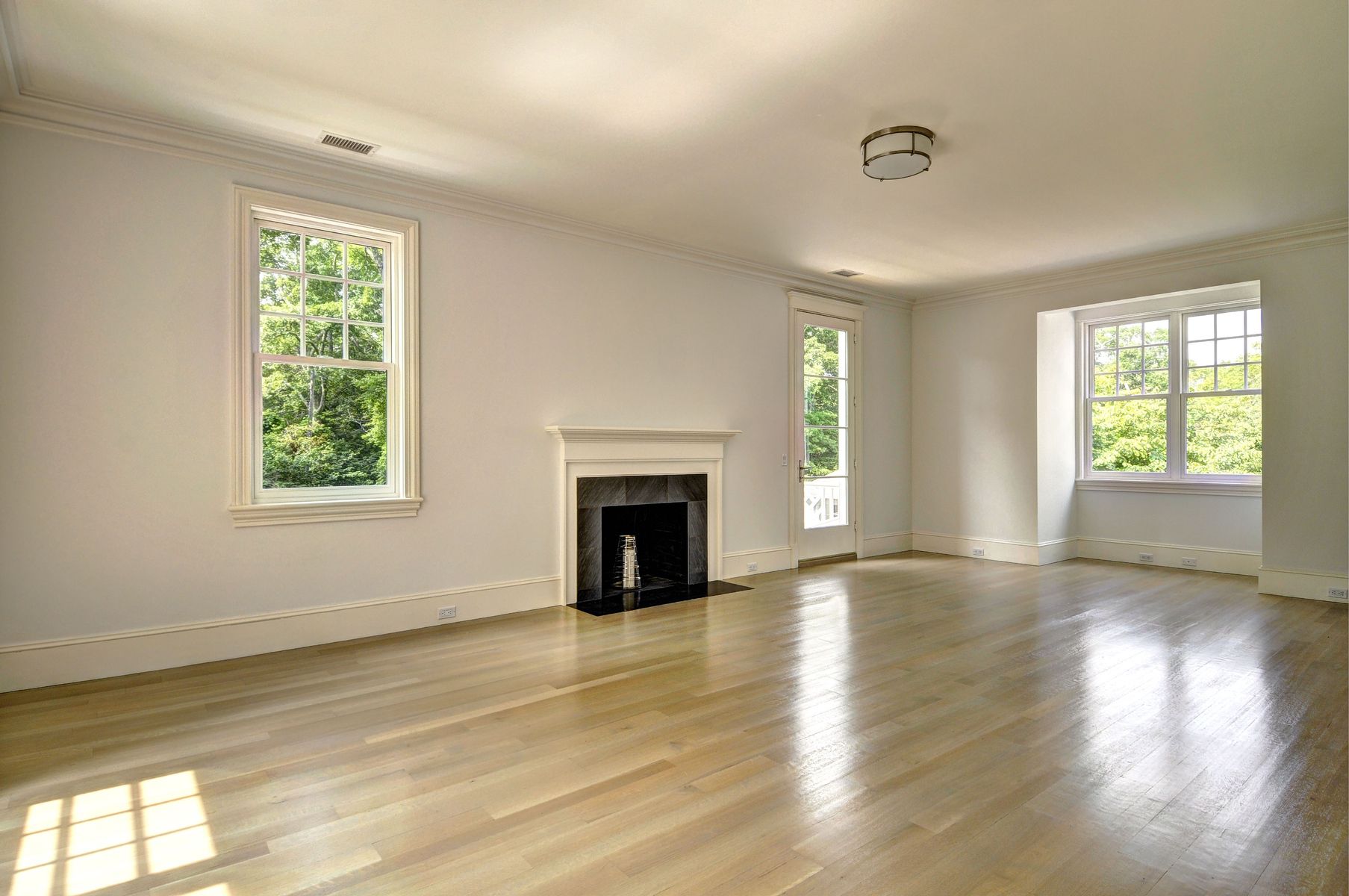 11 Jones Cove Road East Hampton, NY 11937 - Photo 17 of 25 a view of an empty room with wooden floor and a window