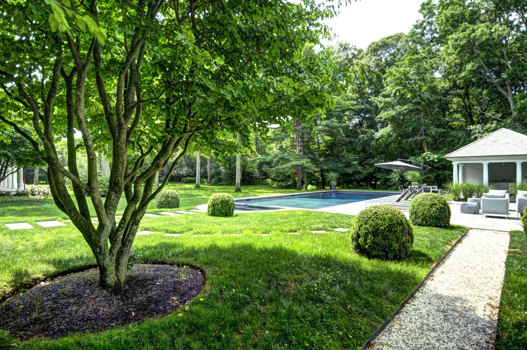 11 Jones Cove Road East Hampton, NY 11937 - Photo 24 of 25 a house view with a sitting space and garden