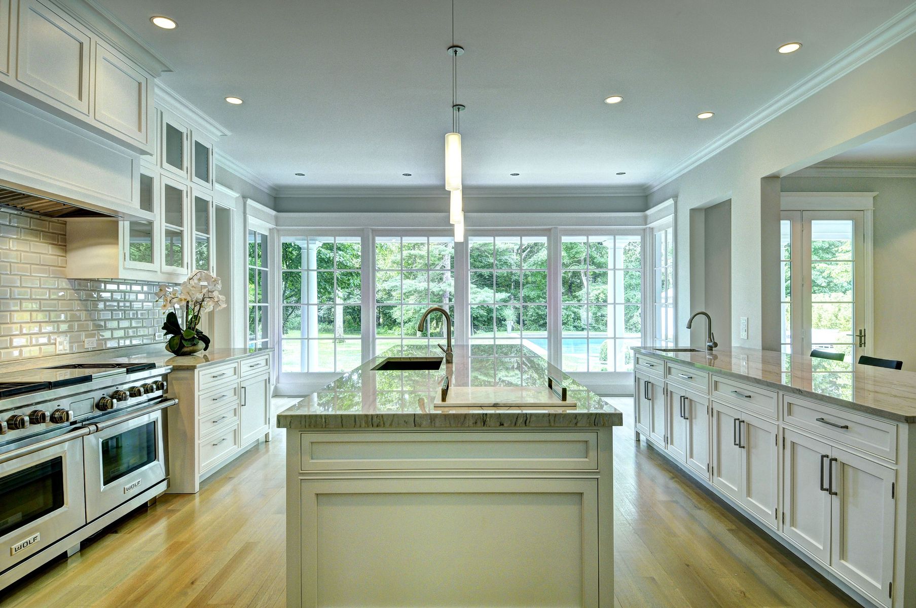 11 Jones Cove Road East Hampton, NY 11937 - Photo 7 of 25 a kitchen with stainless steel appliances granite countertop a stove and a wooden floors