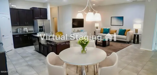 a living room with fireplace furniture and a flat screen tv